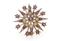 Lot 74 - RUBY AND SPLIT PEARL BROOCH of star form, with...