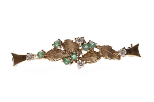Lot 75 - EMERALD AND DIAMOND BROOCH with foliate...