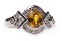 Lot 93 - ORANGE SAPPHIRE AND DIAMOND RING set with a...