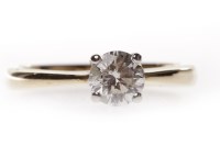 Lot 95 - NINE CARAT GOLD DIAMOND SOLITAIRE RING with a...