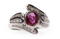 Lot 102 - RUBY AND DIAMOND DRESS RING set with a central...