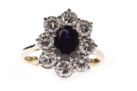Lot 113 - SAPPHIRE AND DIAMOND CLUSTER RING set with a...