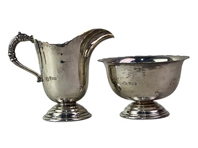 Lot 713 - ELIZABETH II IRISH SILVER SUGAR AND CREAM SET