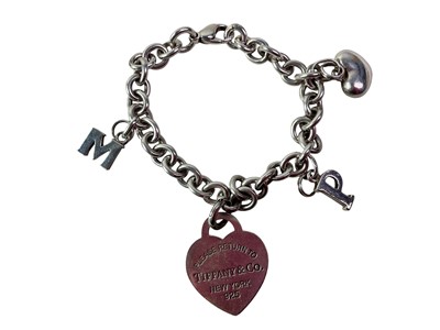 Lot 768 - TIFFANY WHITE METAL LOVE CHARM BRACELET