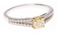 Lot 154 - GIA CERTIFICATED YELLOW DIAMOND RING set with...