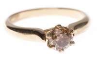 Lot 163 - COGNAC DIAMOND SOLITAIRE RING with a six claw...