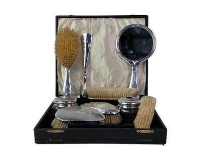 Lot 163 - TWO MATCHED SILVER DRESSING TABLE SETS