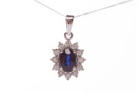 Lot 191 - SAPPHIRE AND DIAMOND CLUSTER PENDANT set with...