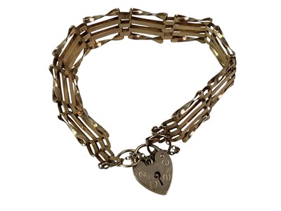 Lot 307 - GOLD GATE BRACELET AND LOCKET