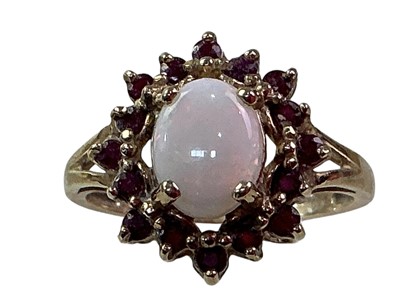 Lot 682 - OPAL AND RUBY DRESS RING