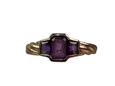 Lot 687 - AMETHYST THREE STONE RING