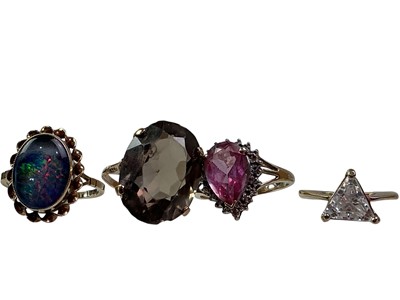 Lot 523 - FOUR GEM SET DRESS RINGS