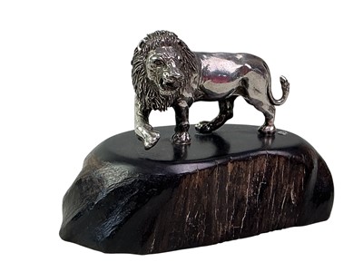 Lot 534 - SILVER LION MINIATURE ON BLACKWOOD BASE