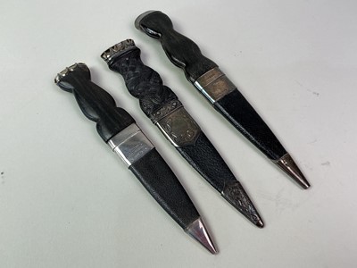 Lot 52 - THREE SILVER MOUNTED SGIAN DUBH