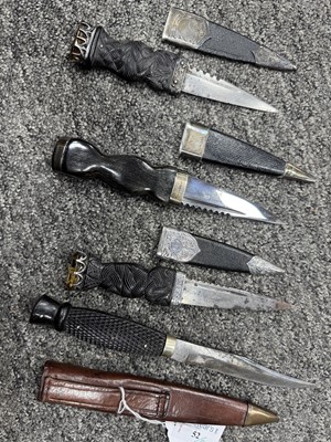 Lot 52 - THREE SILVER MOUNTED SGIAN DUBH