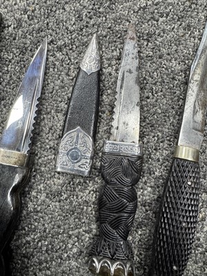 Lot 52 - THREE SILVER MOUNTED SGIAN DUBH