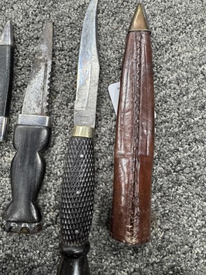 Lot 52 - THREE SILVER MOUNTED SGIAN DUBH