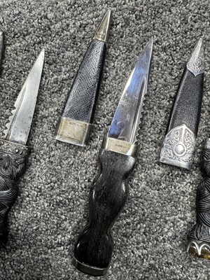 Lot 52 - THREE SILVER MOUNTED SGIAN DUBH