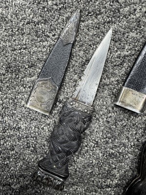 Lot 52 - THREE SILVER MOUNTED SGIAN DUBH