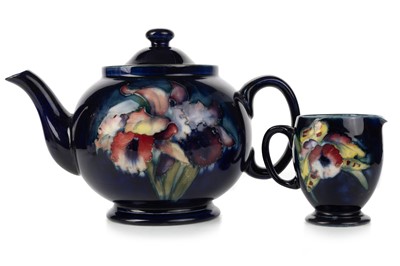 Lot 498 - MOORCROFT TEAPOT AND COVER