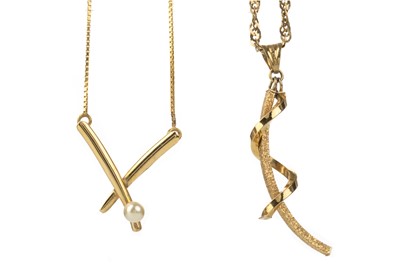 Lot 525 - TWO GOLD PENDANTS ON CHAINS