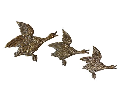 Lot 786 - GRADUATED SET OF THREE BRASS WALL MOUNTING BIRDS