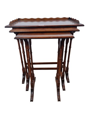 Lot 813 - REPRODUCTION WALNUT NEST OF TABLES