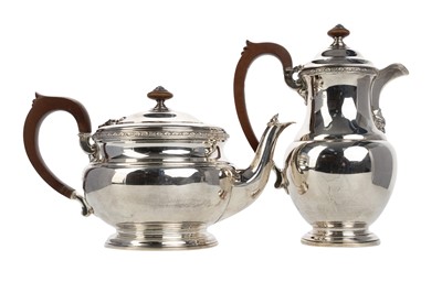 Lot 1076 - GEORGE V SILVER TEAPOT AND HOT WATER POT