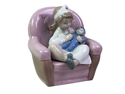 Lot 118 - NAO FIGURE OF A YOUNG BOY WITH TEDDY BEAR