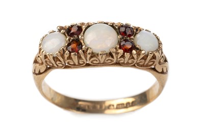 Lot 606 - OPAL AND GARNET BOAT RING