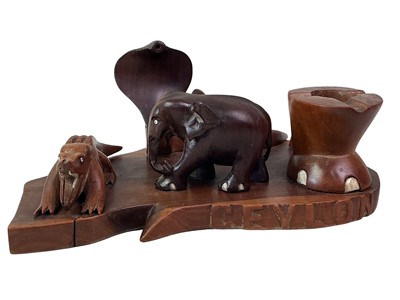 Lot 64 - CEYLONESE CARVED WOOD SMOKER'S STAND