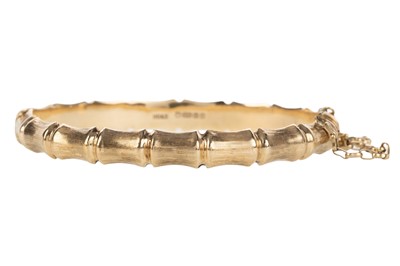 Lot 718 - GOLD BAMBOO EFFECT BANGLE