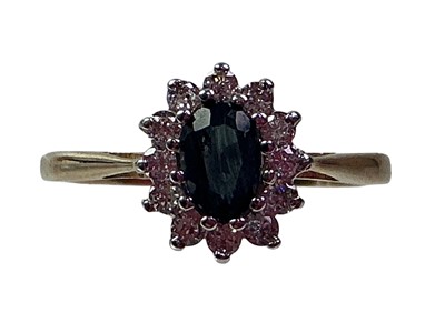 Lot 583 - SAPPHIRE AND CUBIC ZIRCONIA CLUSTER RING