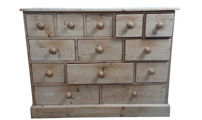 Lot 676 - STRIPPED PINE CHEST OF THIRTEEN DRAWERS