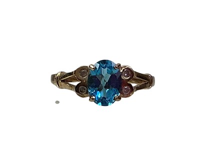Lot 518 - TOPAZ AND DIAMOND RING