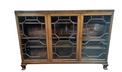 Lot 566 - MAHOGANY THREE DOOR BOOKCASE