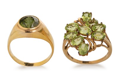 Lot 596 - TWO PERIDOT RINGS