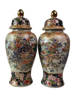 Lot 644 - PAIR OF CHINESE STONEWARE LIDDED VASES