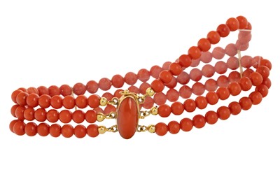 Lot 721 - TRIPLE STRAND CORAL BEAD BRACELET