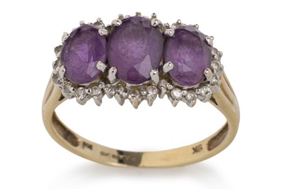 Lot 759 - AMETHYST TRILOGY RING