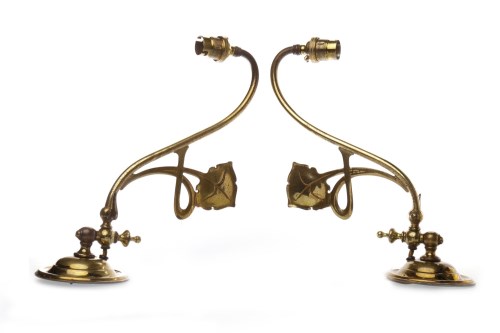 Lot 1257 - PAIR OF GLASGOW SCHOOL BRASS WALL SCONCES of...