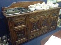 Lot 1342 - VICTORIAN CARVED OAK SIDEBOARD the central...