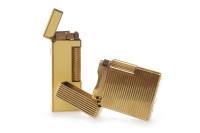 Lot 1347 - DUNHILL CREAM ENAMEL AND GOLD PLATED LIGHTER...