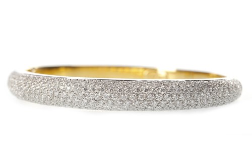 Lot 207 - EIGHTEEN CARAT GOLD DIAMOND BANGLE with pave...