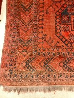 Lot 671 - AFGHAN BOKHARA BORDERED CARPET decorated with...