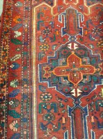 Lot 693 - TURKISH BORDERED RUG decorated with large...