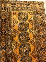 Lot 696 - AFGHAN BOKHARA RUG decorated with six central...
