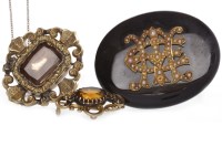 Lot 2 - THREE VICTORIAN BROOCHES comprising an oval...