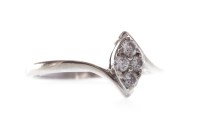 Lot 10 - DIAMOND CLUSTER RING with a marquise shaped...