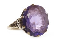 Lot 11 - LARGE AMETHYST DRESS RING set with a single...